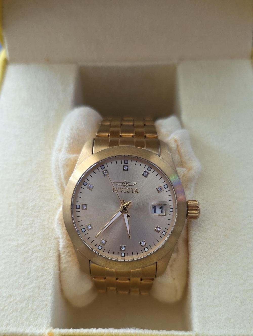 Invicta Gold Tone Watch with Champagne Dial and Crystal Markers, Date Display.